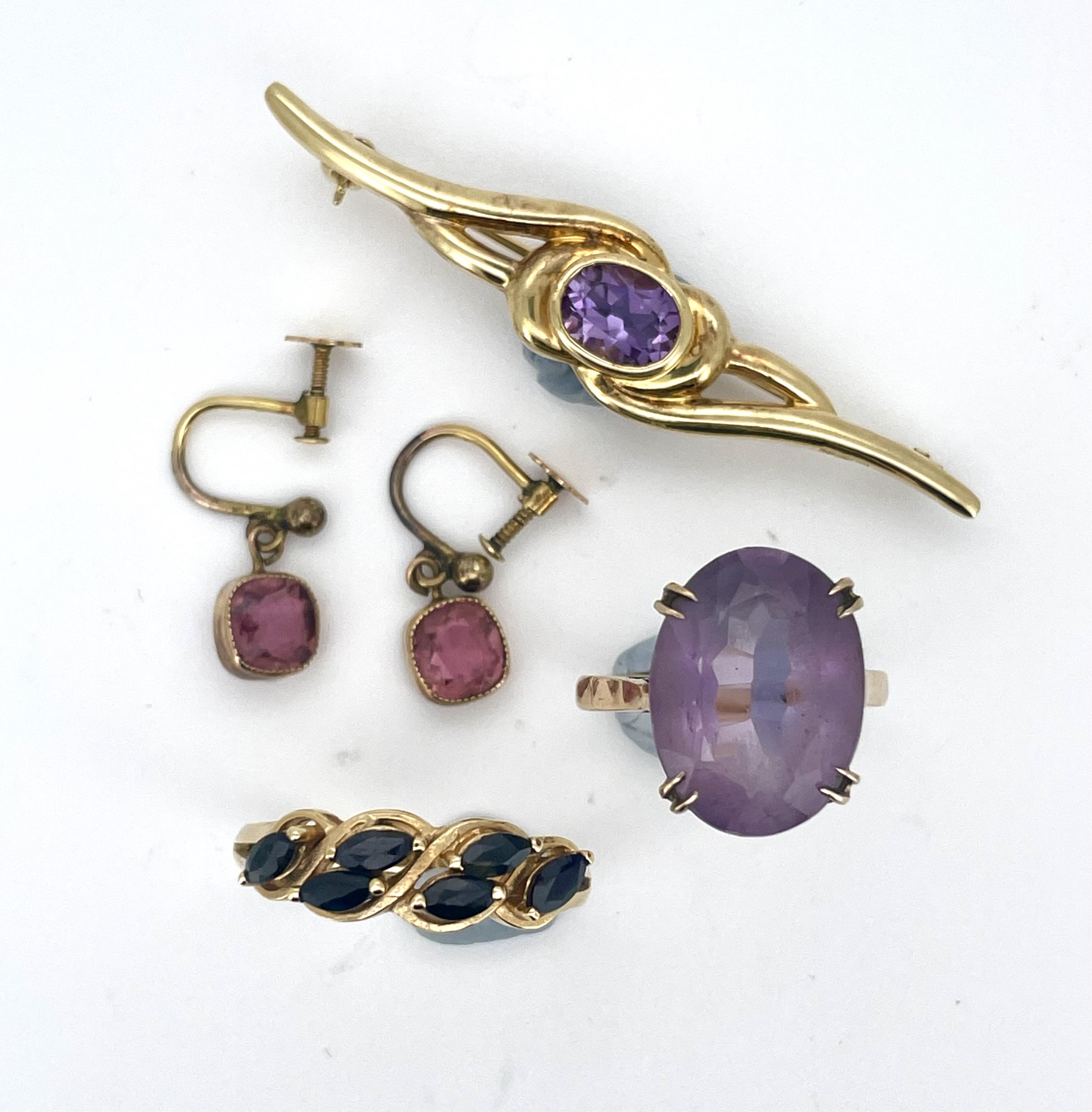 A collection of jewellery, comprising: an amethyst single stone ring, size N, stamped 9CT, gross weight approximately 4 grams; a pair of drop earrings suspending cushion-shaped pink tourmalines, in gold, screw fittings;